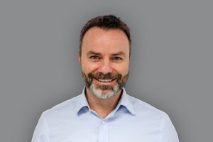 Headshot of Tim Howell, Managing Director - read his biography