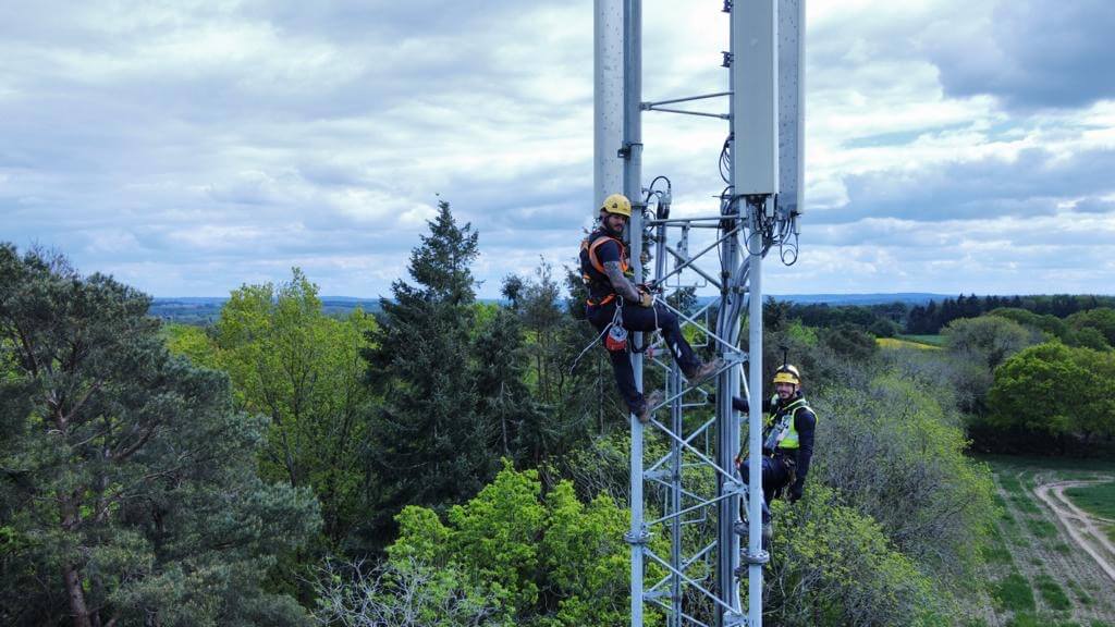 Mitie staff climbing a telecoms tower
