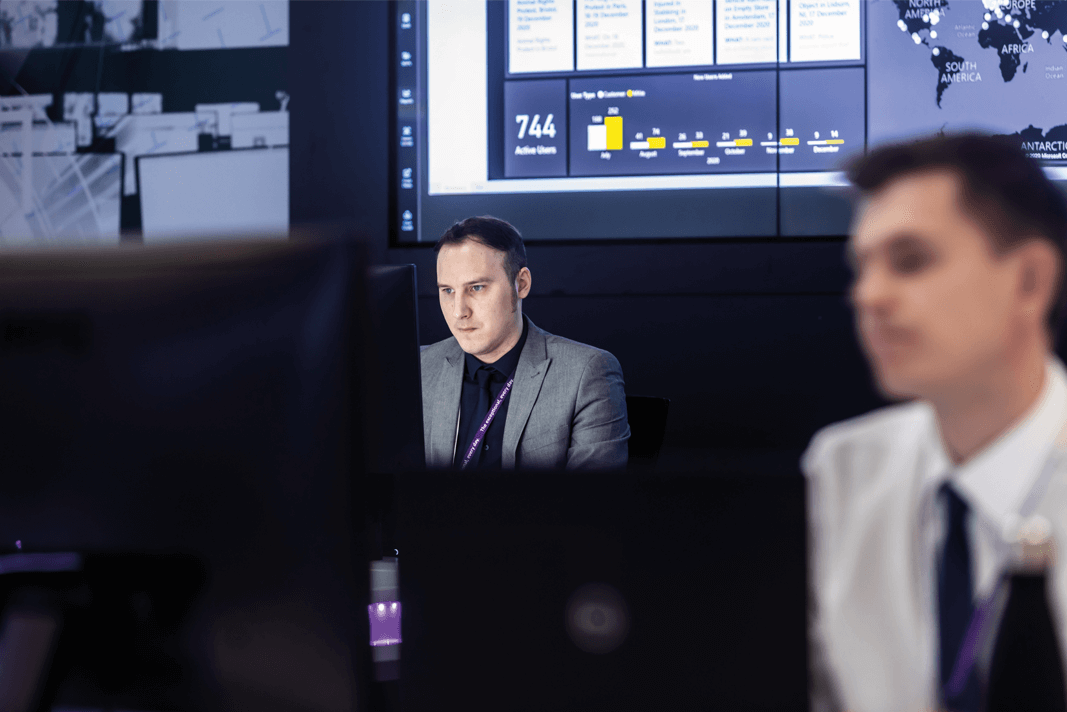 An analyst working on a computer