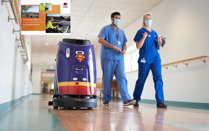 Superman hospital robot cleaner with two staff in blue scrubs