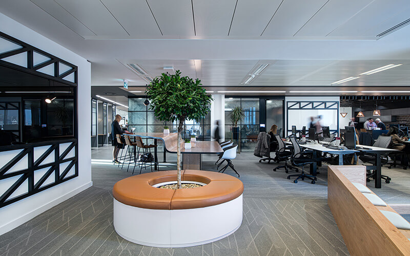 Modern office workspace with different areas for employees