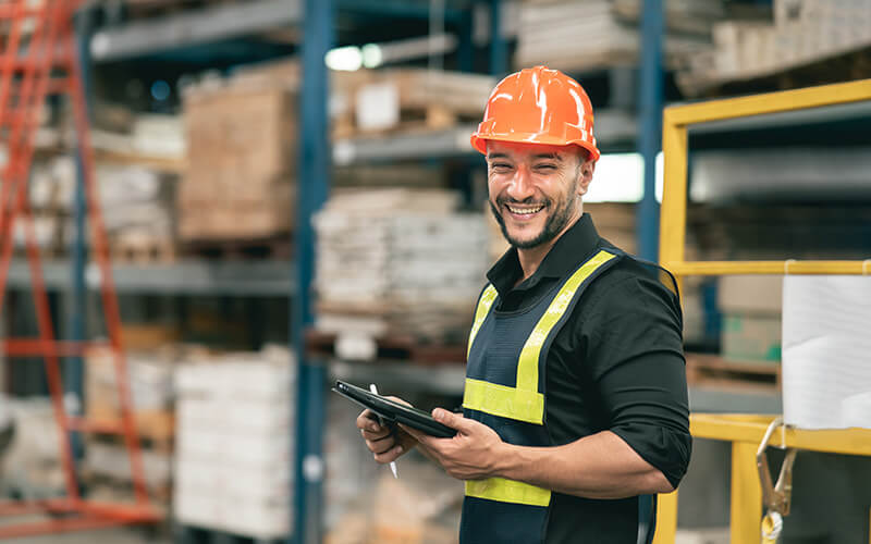 Man in hard hat working in a warehouse