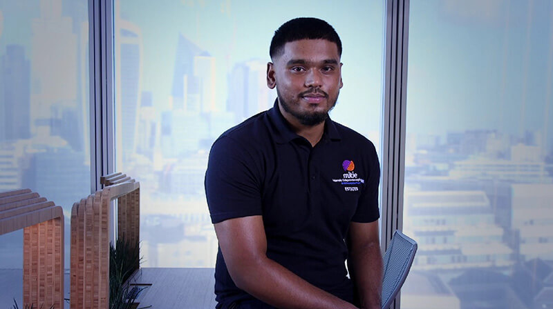 Mitie male electrical engineering apprentice sitting by the window view in The Shard