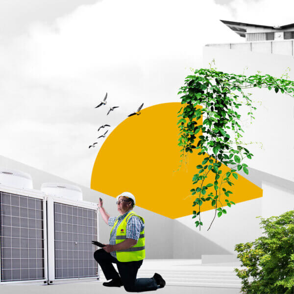 A Mitie engineer looks at a heating fan, with greenery and a yellow sun behind