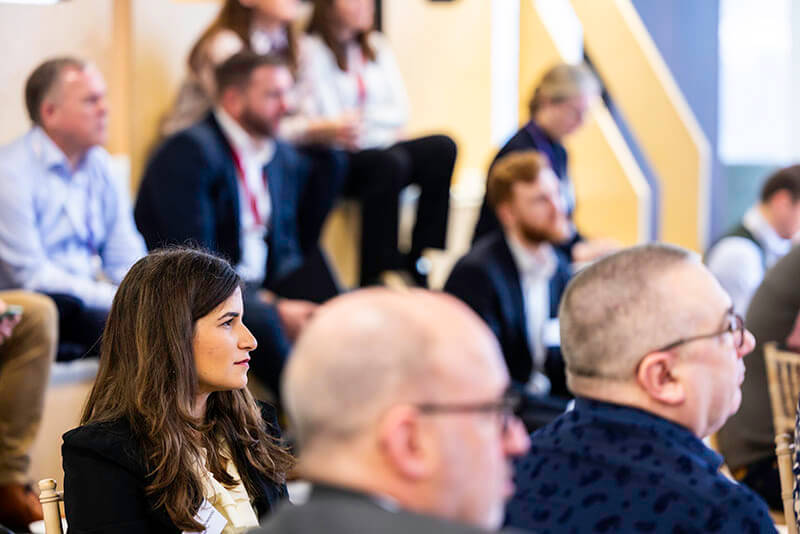 Mitie employees and guests listening at a Decarbonisation Delivered breakfast briefing