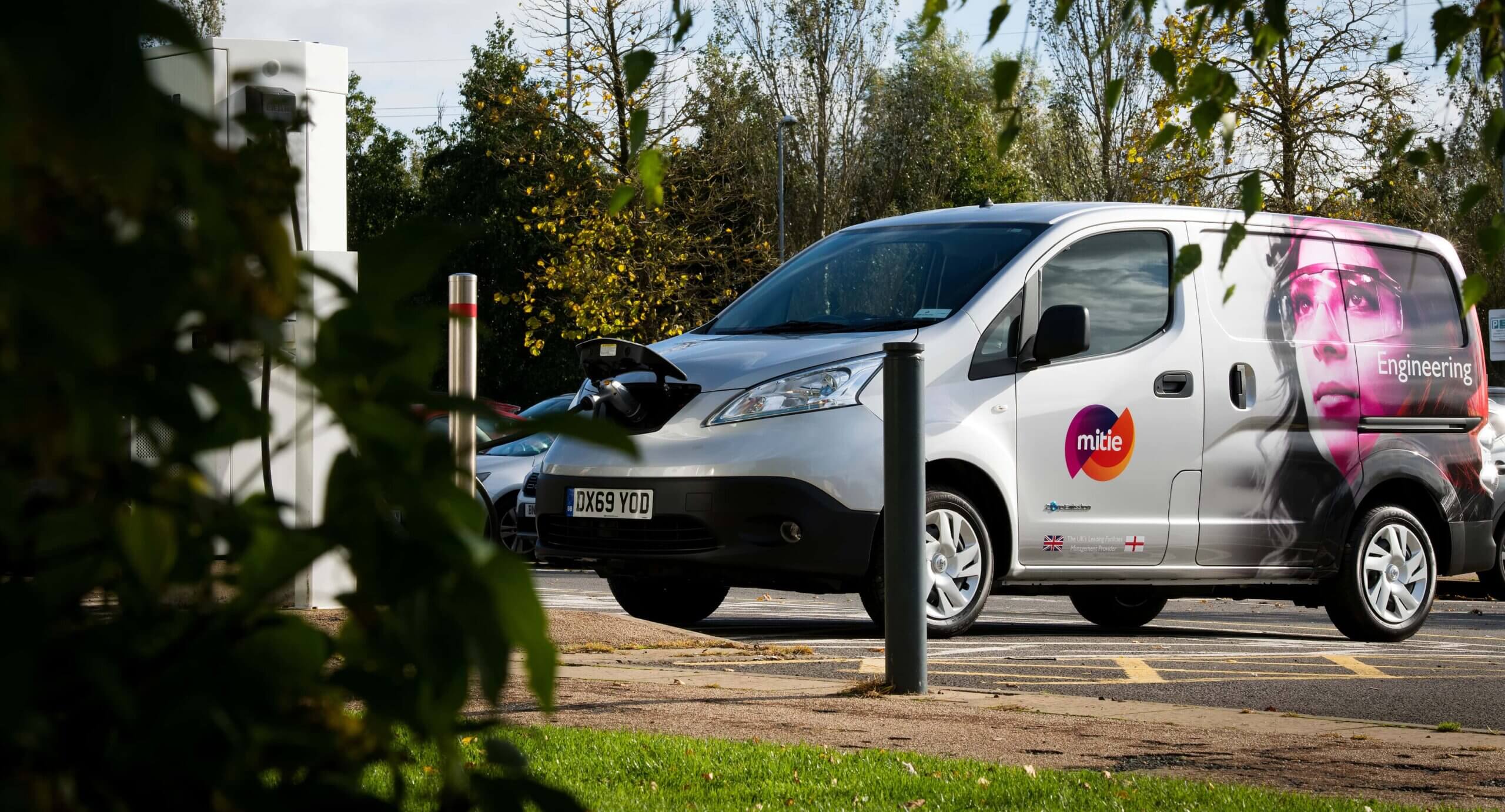 Mitie branded-van plugged into an electric charger