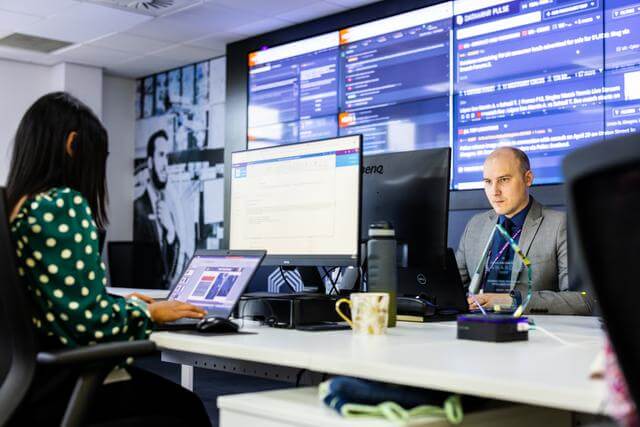 Mitie staff working at desks in the Mitie Intelligence Centre