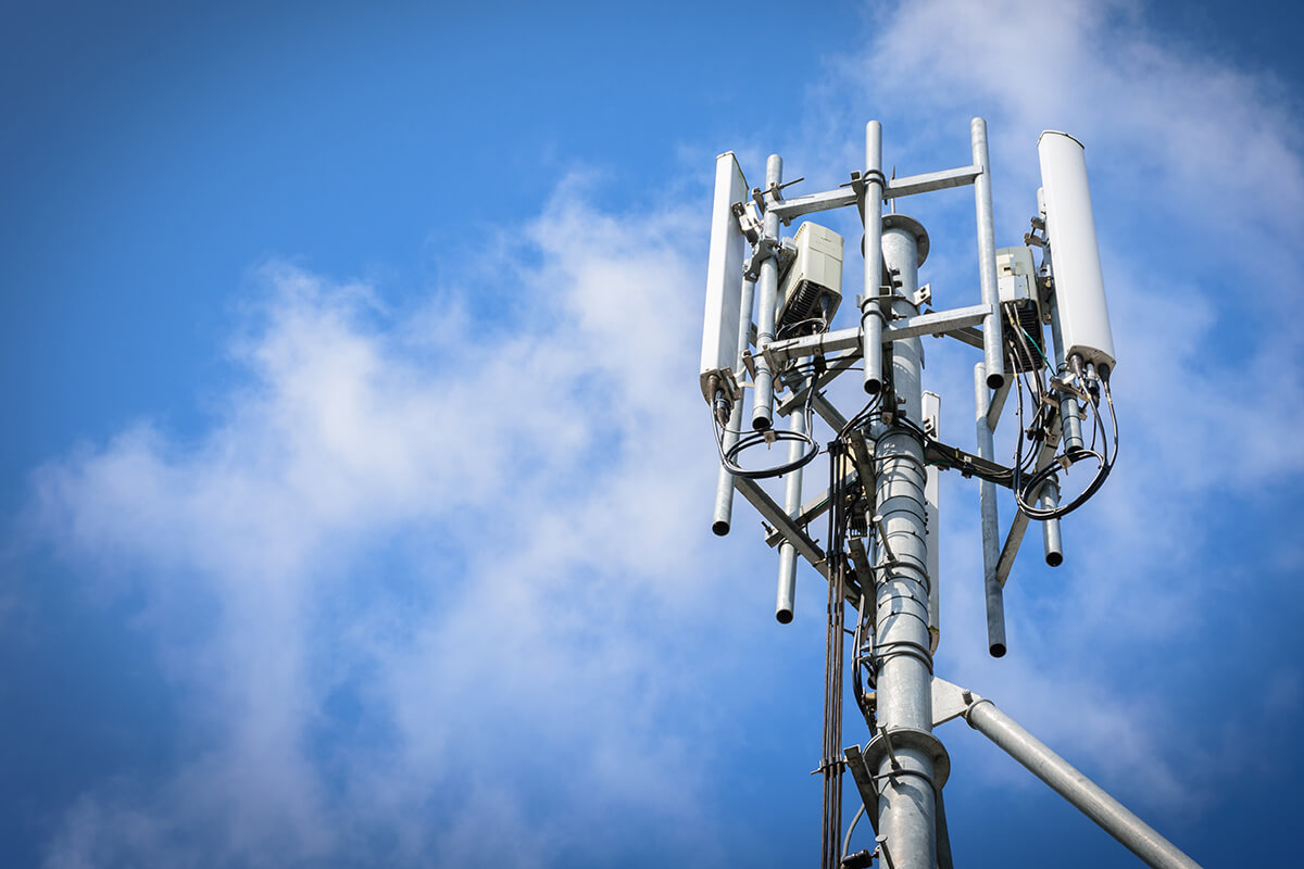 Telecoms tower in front of a blue sky