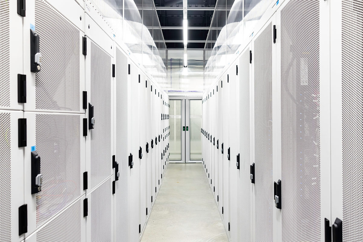 White corridor interior of cabinets in a data centre