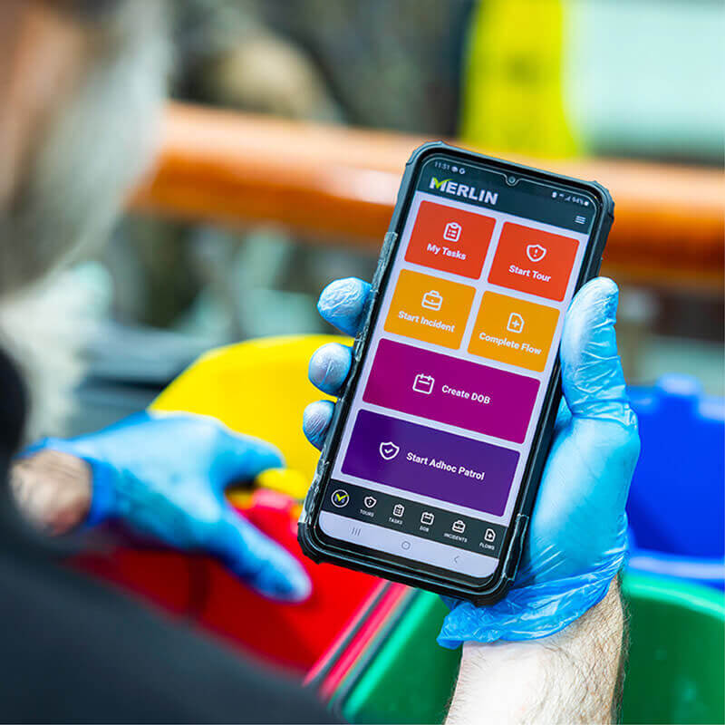 A smartphone device showing Merlin Connect tasks, as coloured blocks on the screen