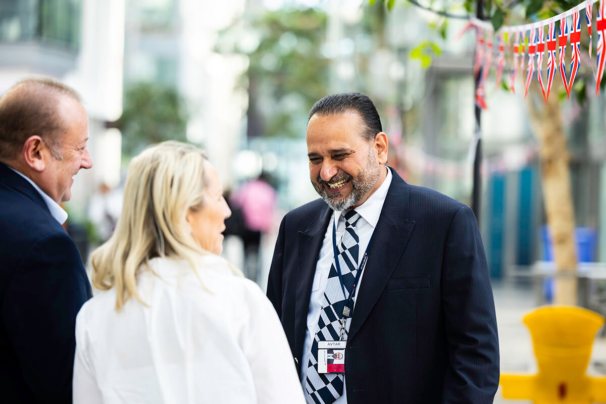 Mitie security guard smiling at a community event