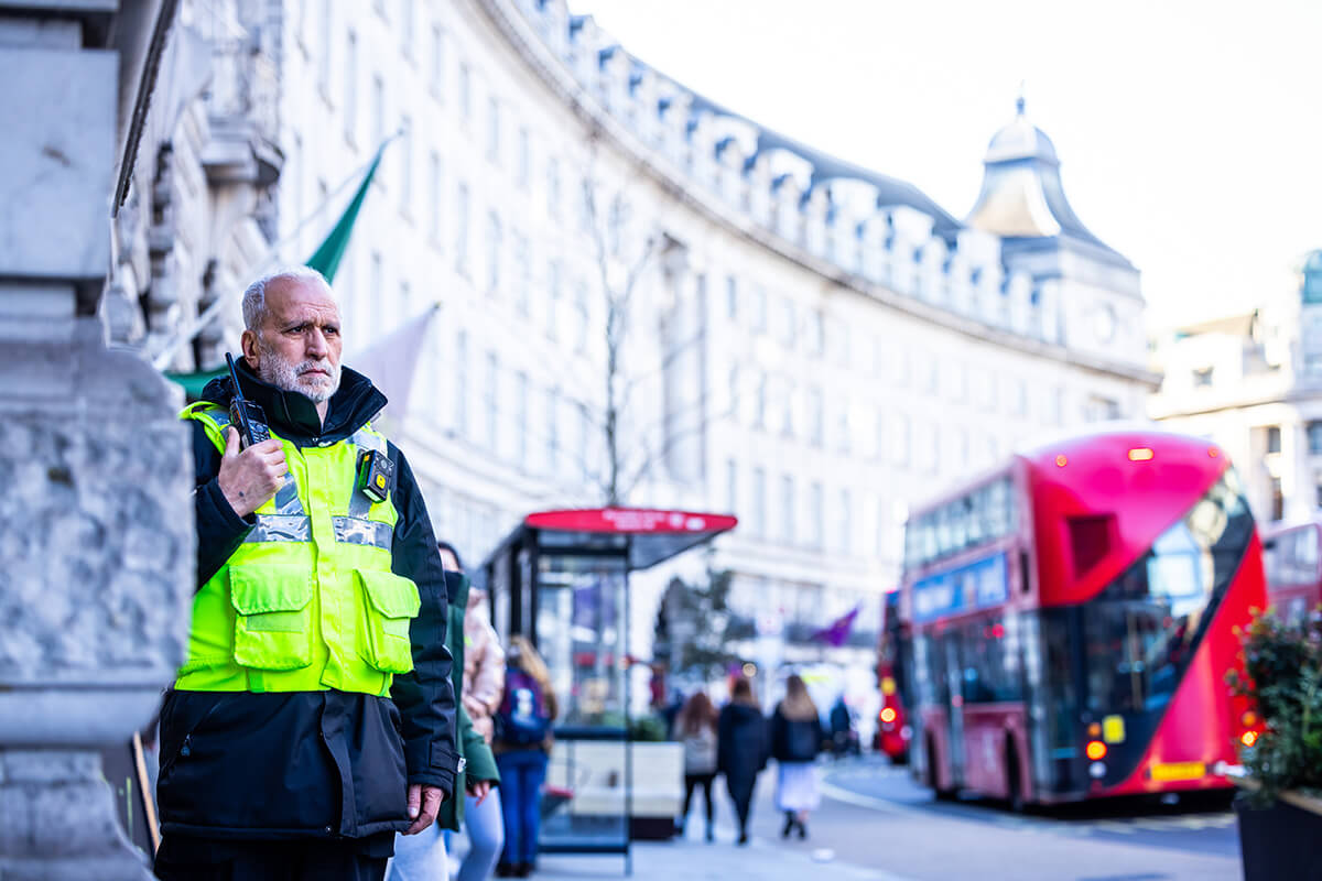 Security guard holding a radio in London