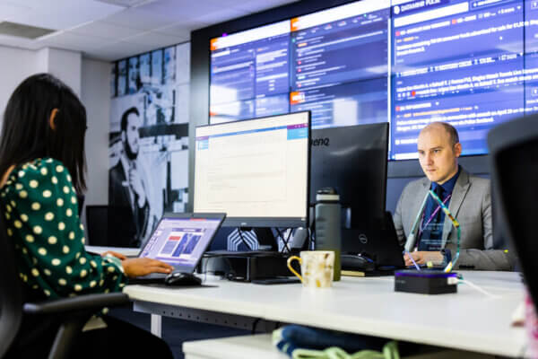 Mitie Intelligence colleagues working at desks