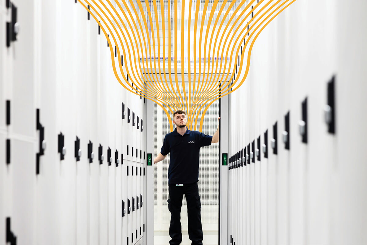 A data centre work with a yellow wavy line rising above him