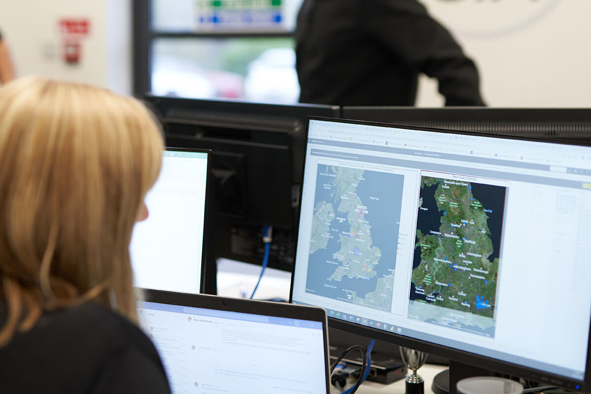 Mitie Intelligence officer looking at a map of the UK
