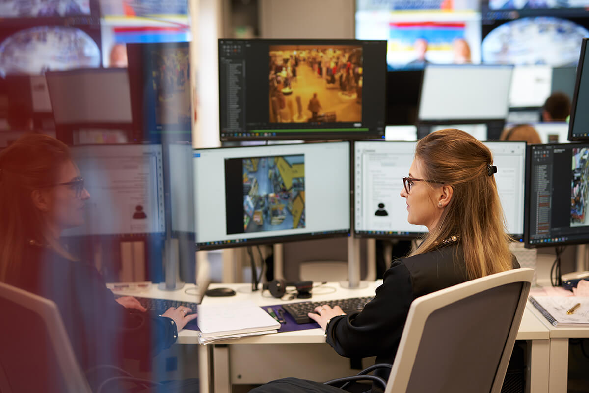Mitie Intelligence officer at work at her desk
