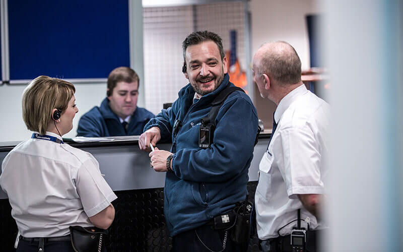 Care & Custody colleagues talking at the welcome desk