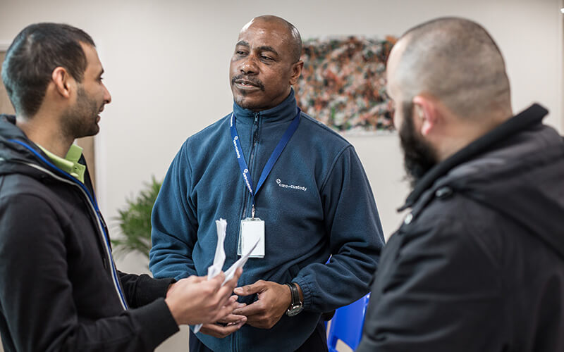 A group of Care & Custody colleagues talking