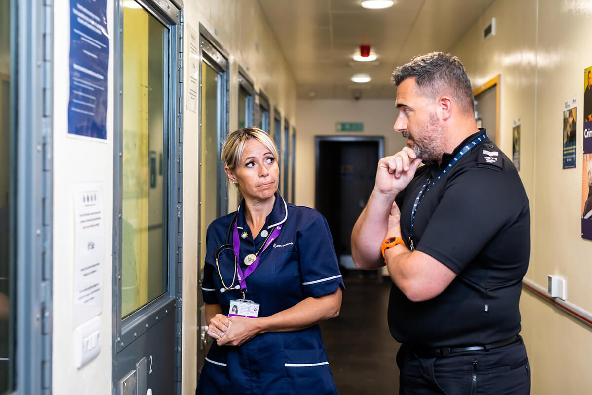 Nurse outside a police detention cell