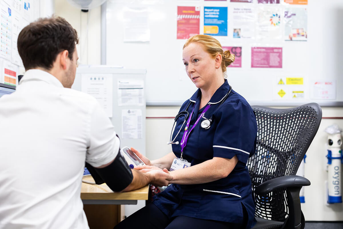 Care and Custody nurse taking blood pressure