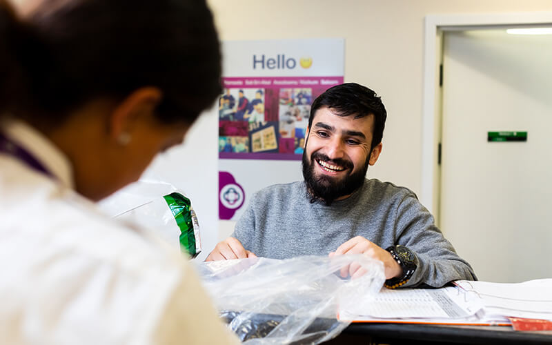 Man smiling at Care and Custody reception