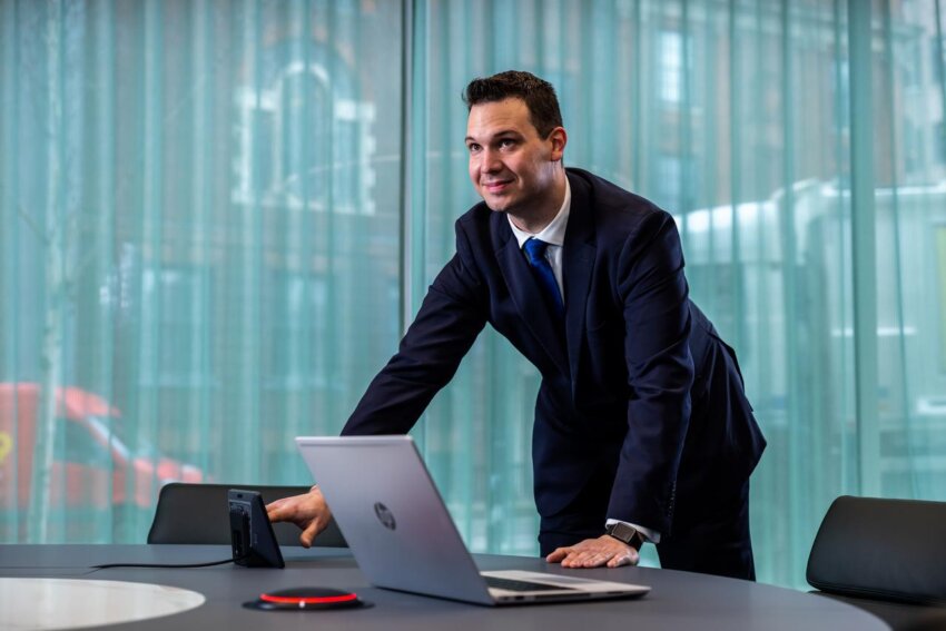 Guest services colleague setting up meeting technology