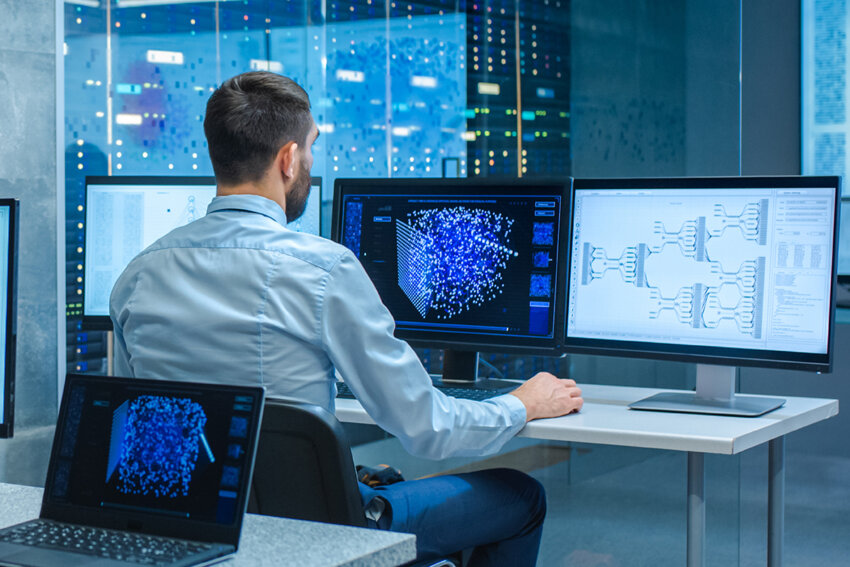Office worker visualising data on a computer