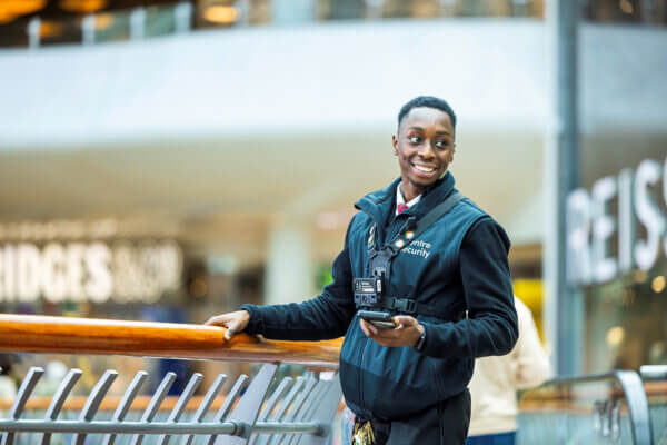 Smiling Mitie security guard