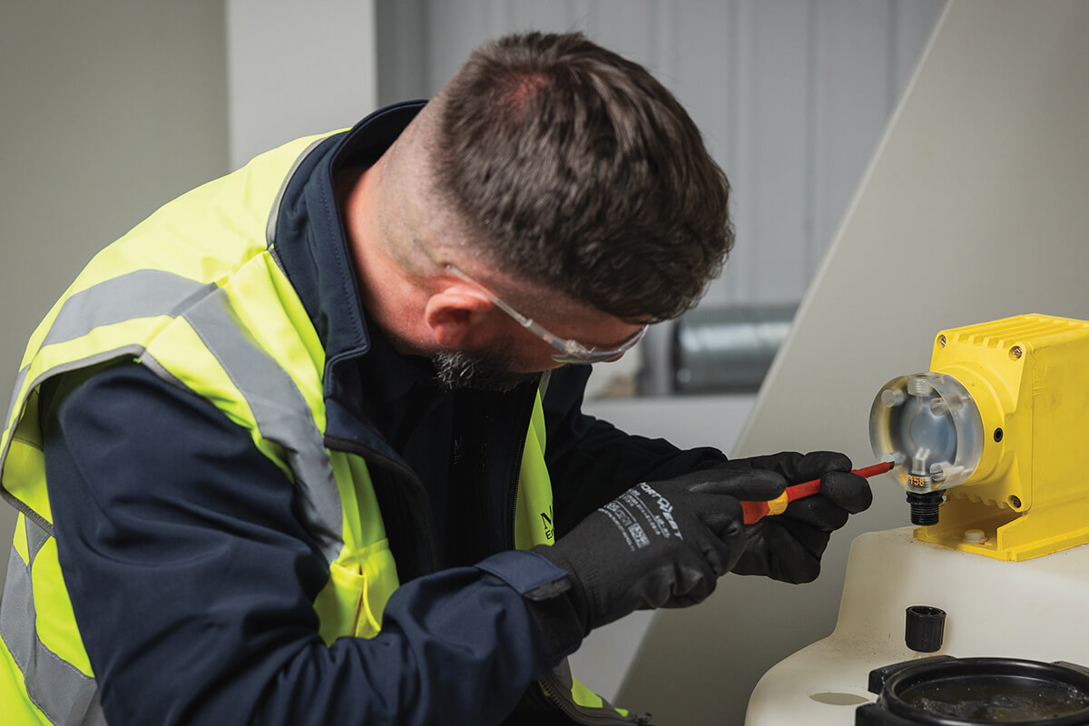 Mitie engineer working on a tool