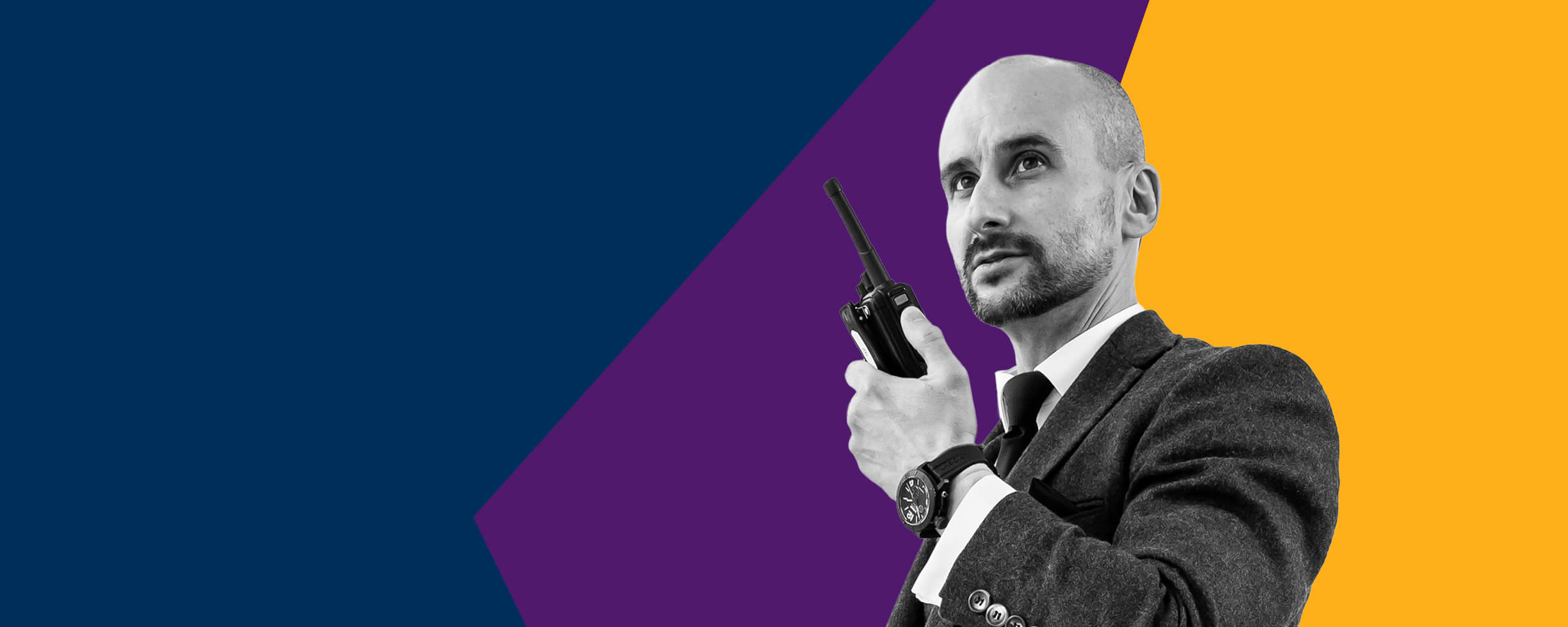 Security guard using a radio, with bold colours behind him