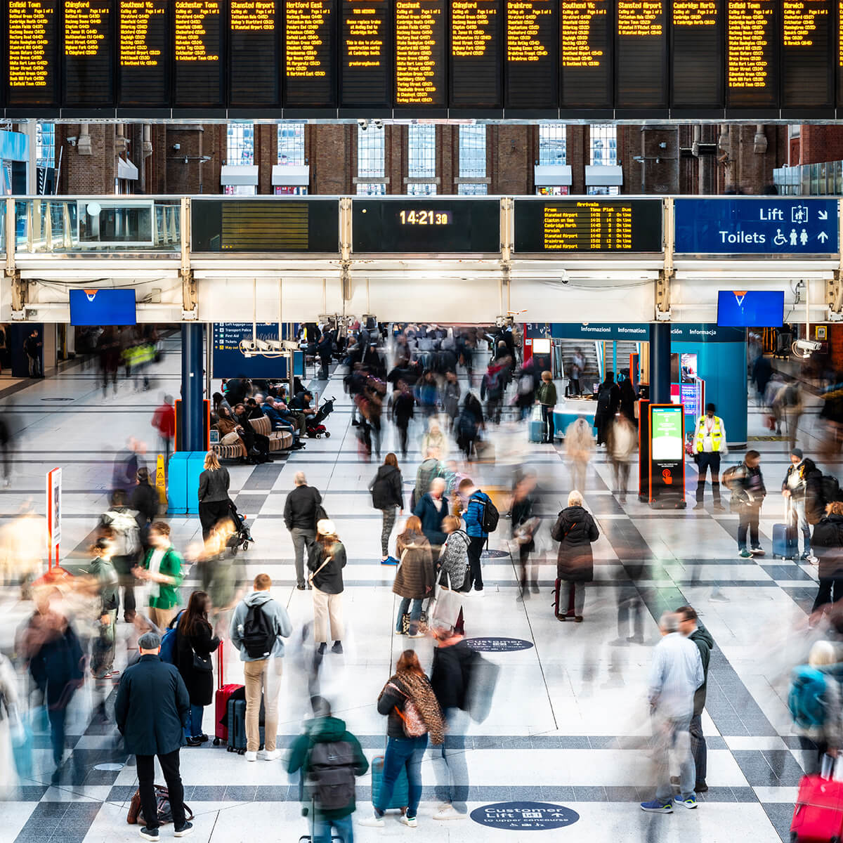 Busy rail station concourse