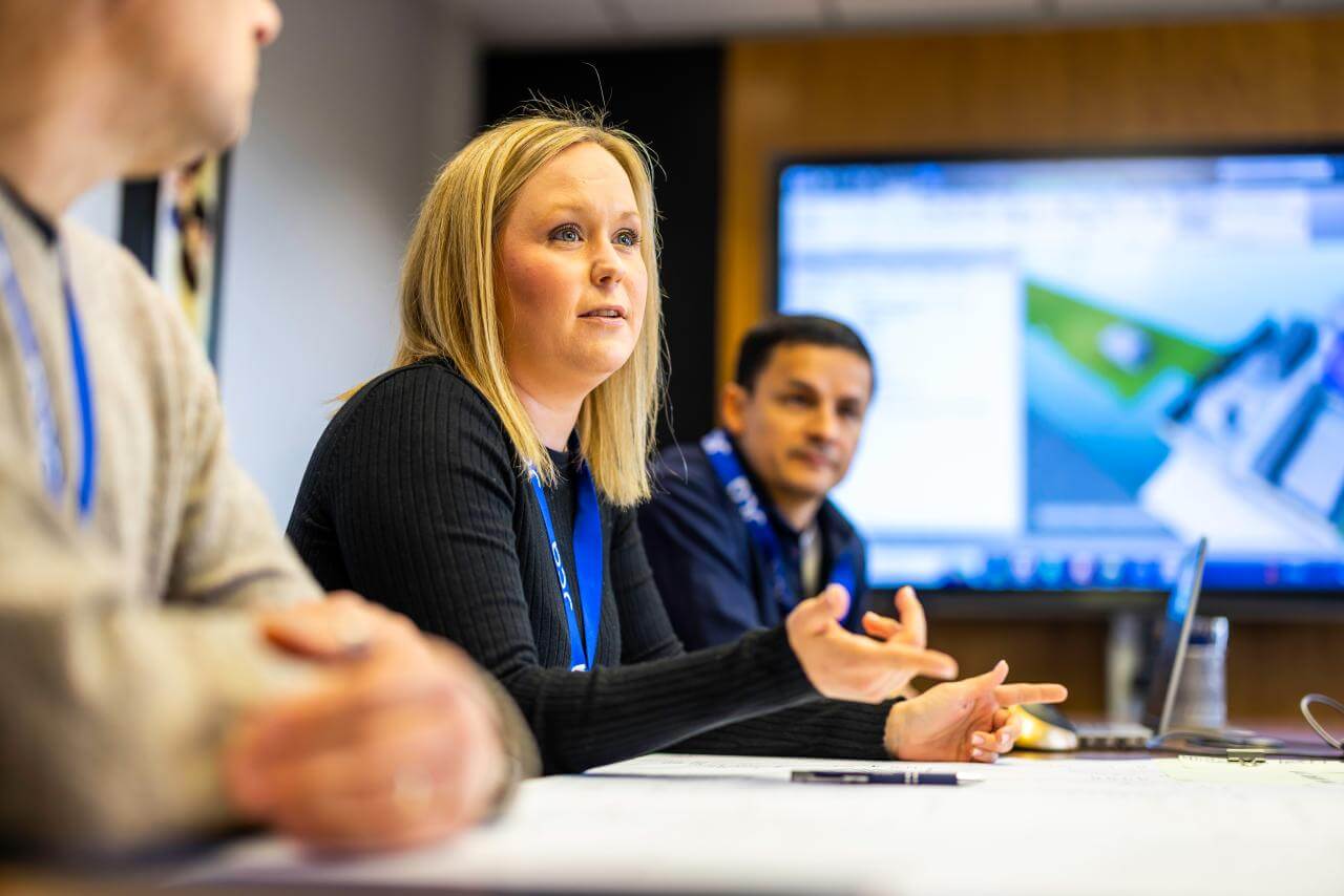 JCA colleagues in a meeting