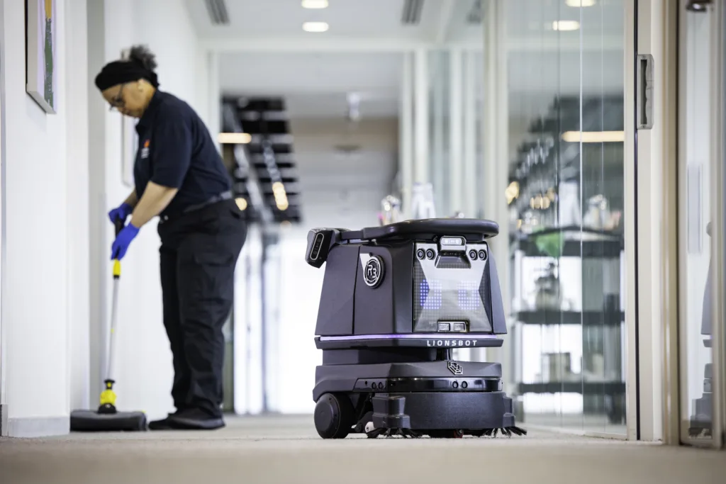 Mitie colleague and robot cleaner