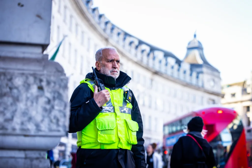Security guard holding a radio in London