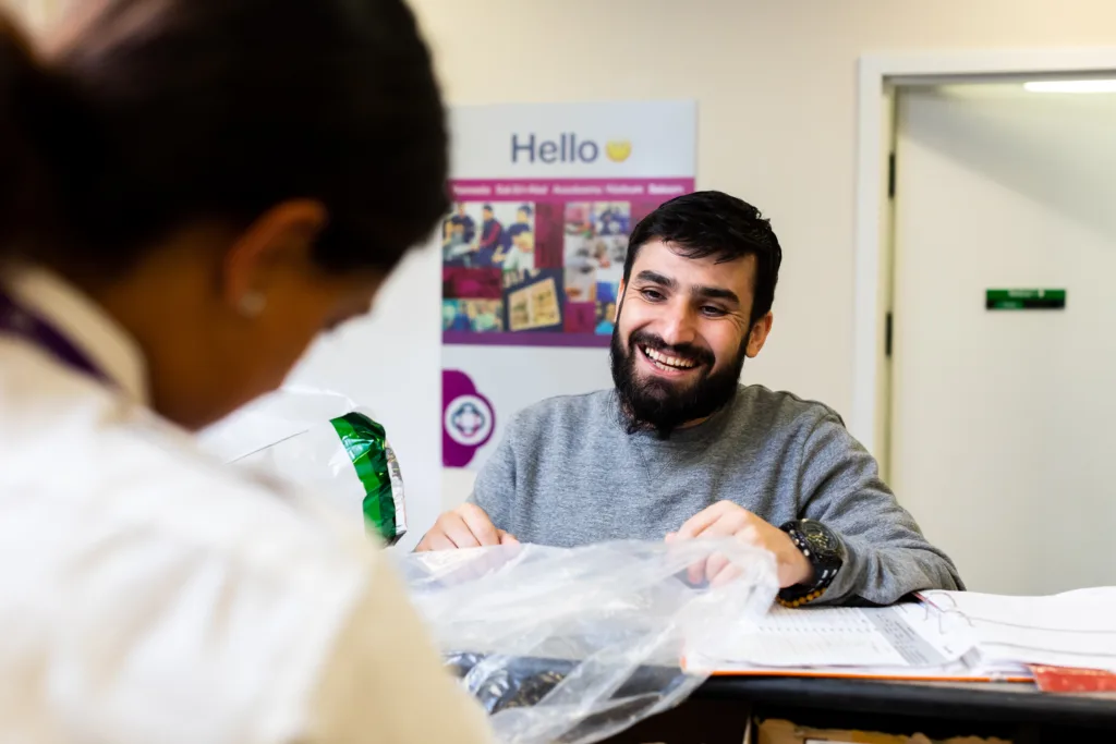 Man smiling at Care and Custody reception