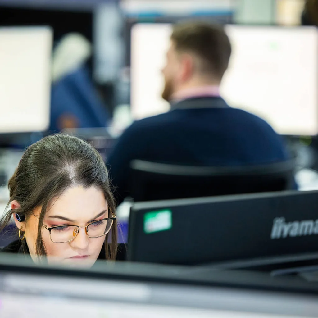 Mitie Intelligence officer looking at a screen