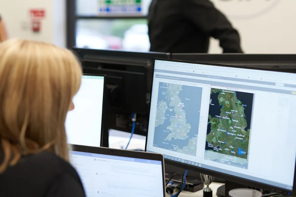 Mitie Intelligence officer looking at a map of the UK