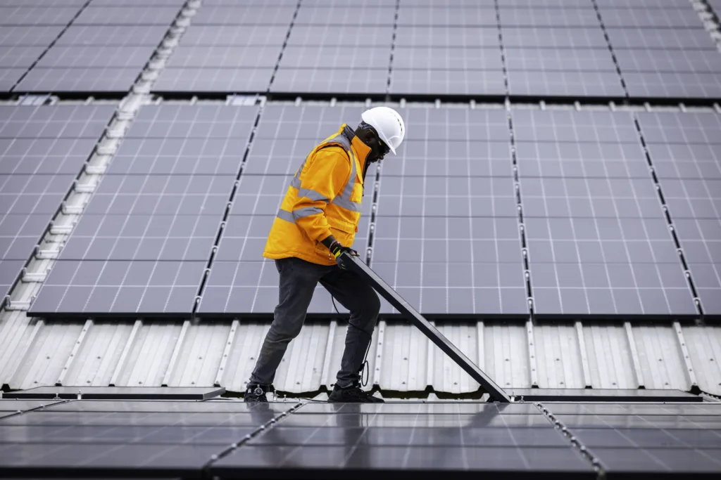 Custom Solar colleague fitting a solar panel