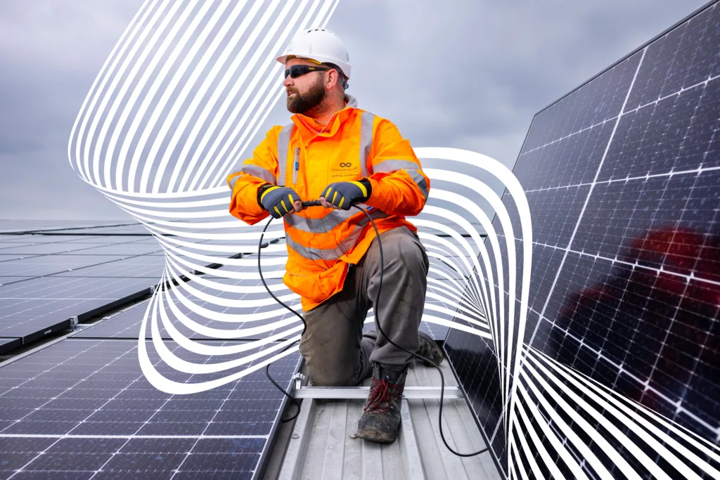 A Custom Solar engineer connecting a solar panel with wavy white lines around him