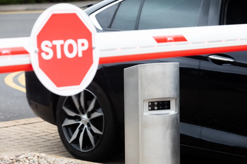 Lowered car barrier, showing a 'stop' sign