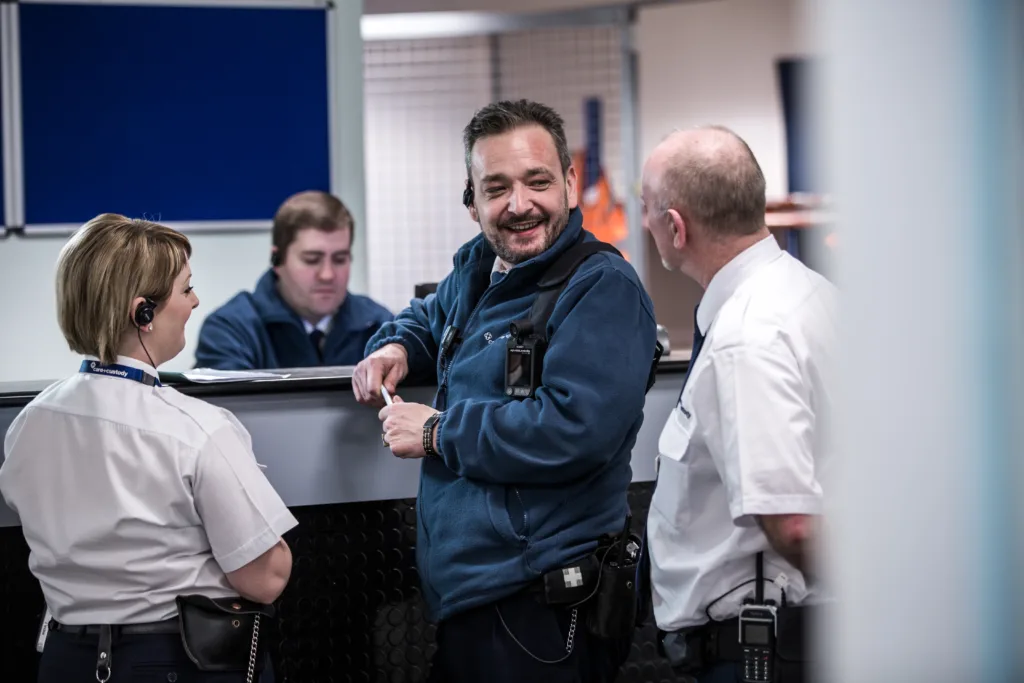 Care & Custody colleagues talking at the welcome desk