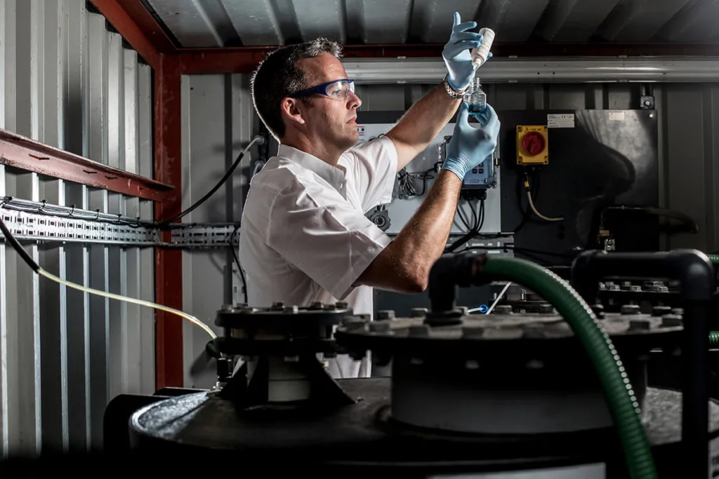Man chemically testing water samples