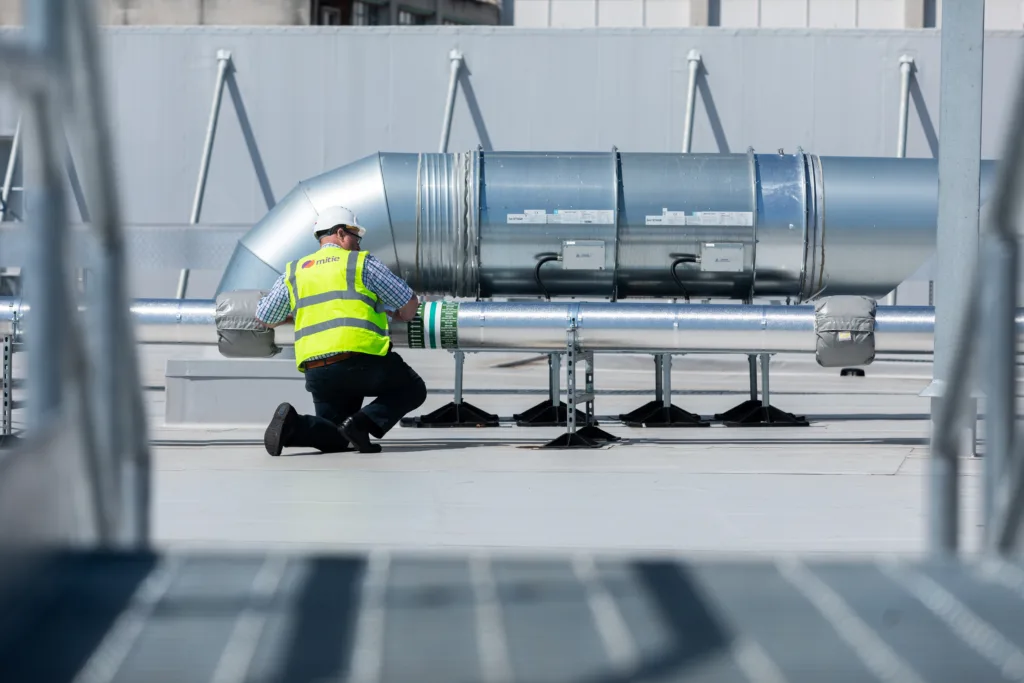 Mitie engineer on a rooftop