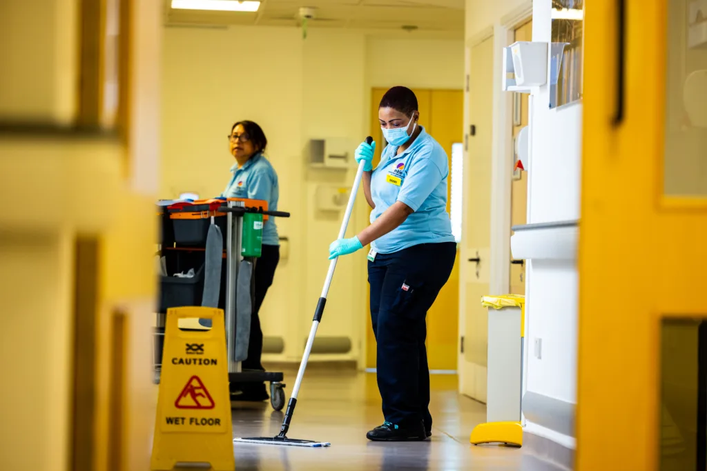 Mitie cleaner mopping in hospital