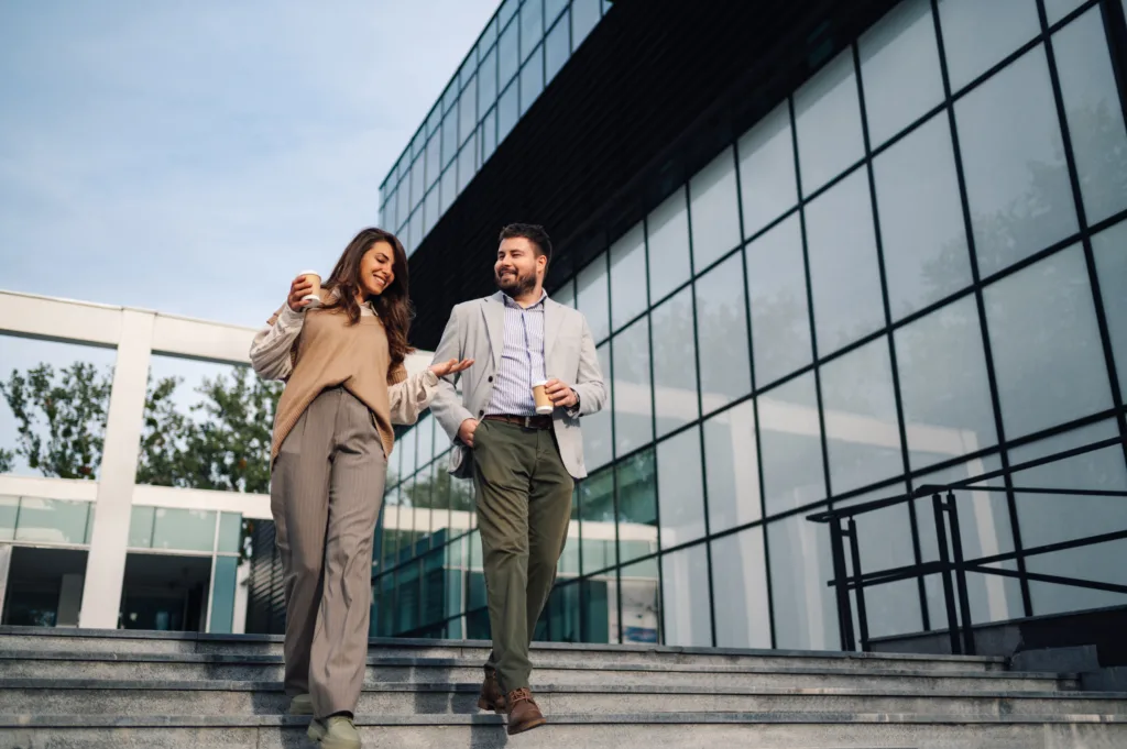 Office colleagues walking down steps