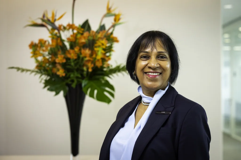 Mitie colleague with decorative flowers