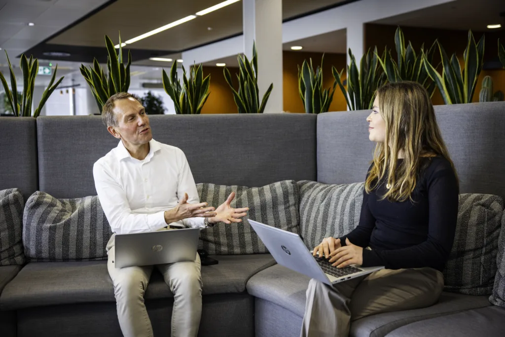 A meeting in an open plan office