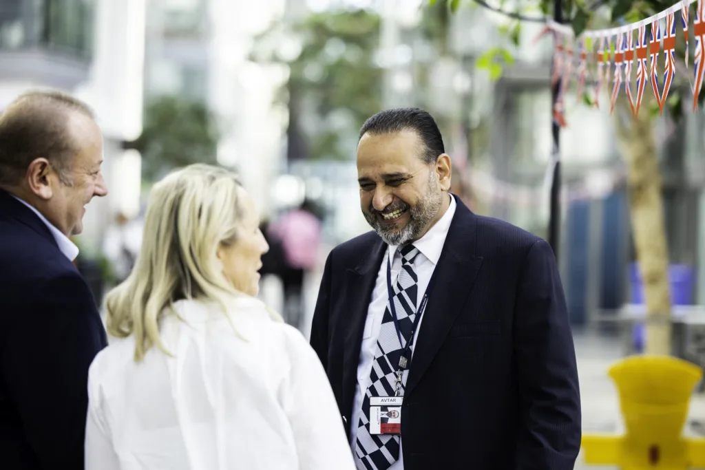 Mitie security guard smiling at a community event