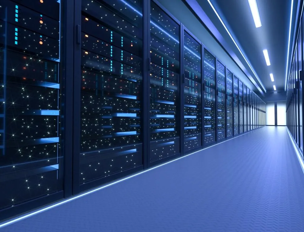 A corridor of data centres, lit in blue light