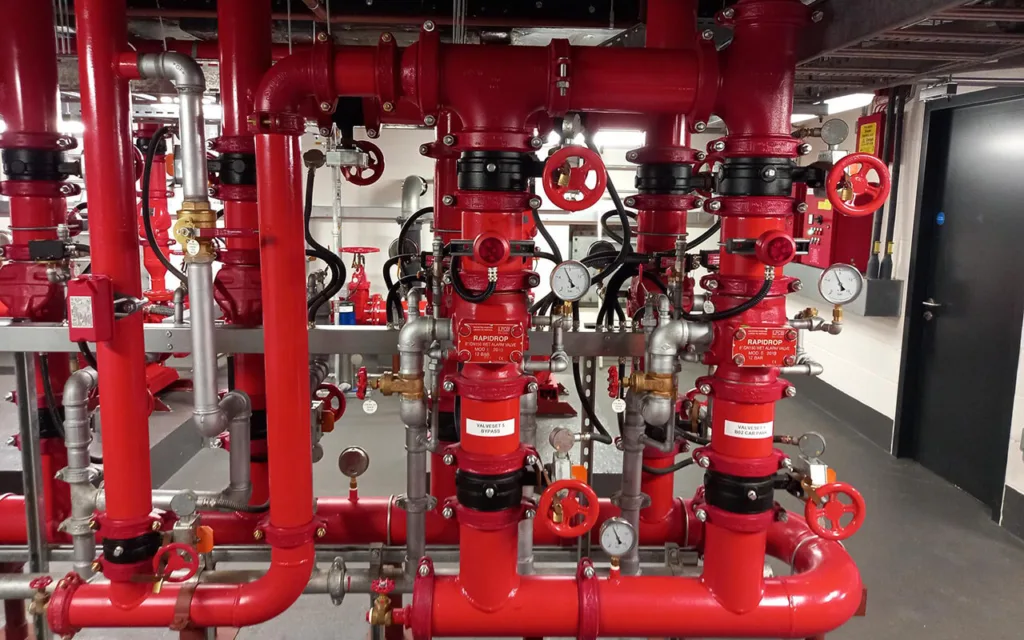 Close up of red pipes of a pressurised fire protection system